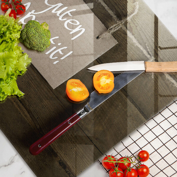 Steklena podloga za rezanje Napis Guten Appetit na lesenih deskah